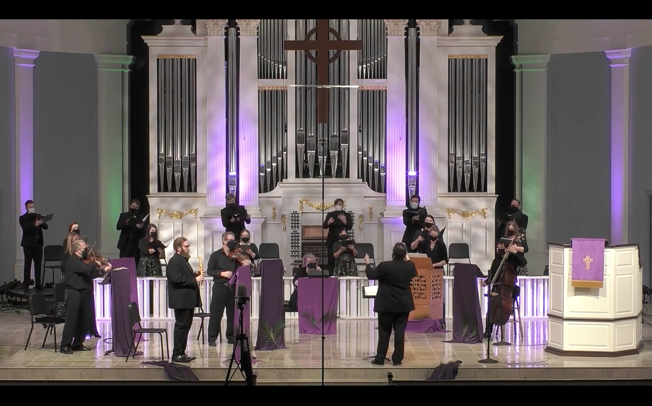 Choir and instrumentalists perform in church.