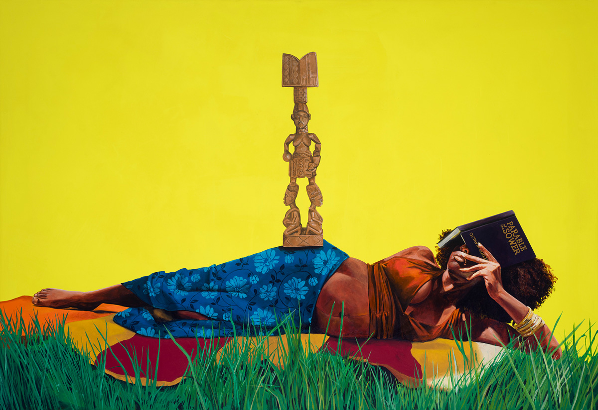 A pregnant Black woman reclines on a blanket in the grass; she covers her face with a book titled “Parable of the Sower” and a statue of a god-like figure balances on her hip