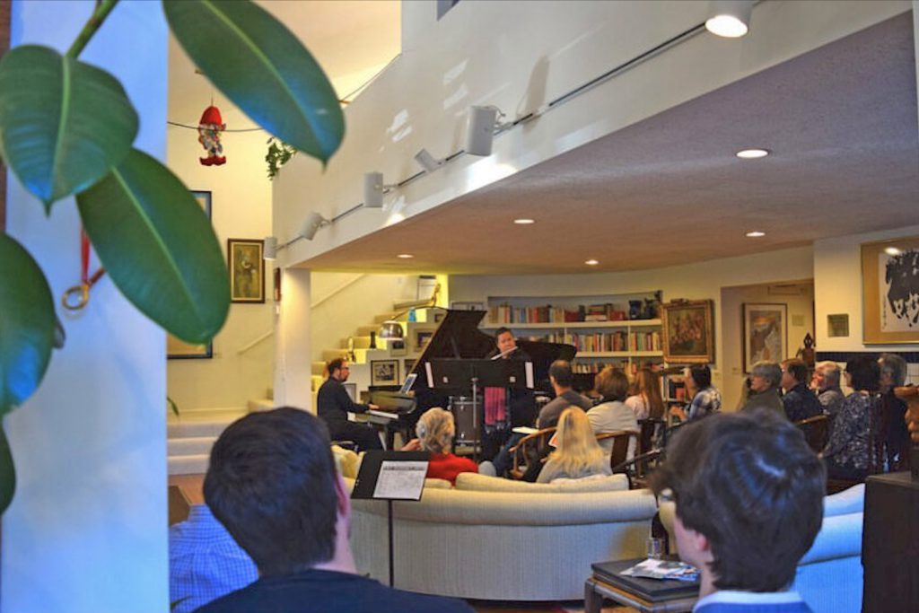 Charles Dickinson on piano with Christina Webster on flute in a fall 2019 newEar performance at the Diastole Scholars’ Center.