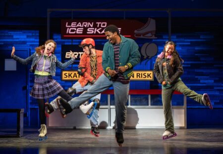 A group of teens dance at a skating rink.